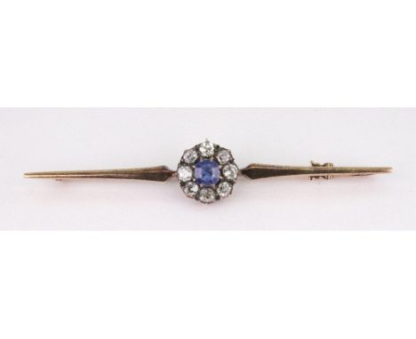 A late Victorian gold, sapphire and diamond cluster bar brooch, centred with a cushion-shaped sapphire within an old-cut diam