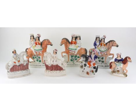 A pair of Staffordshire pottery figures of a boy and girl on horseback jumping fences, 16cm high, two others of children on h