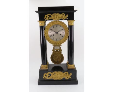 Robert A Paris:  A Napoleon III ebonised gilt metal mounted Portico clock, the silvered dial with Roman numerals, the 8-day m