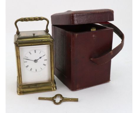 A brass cased carriage clock, late 19th century, with push repeat striking on a bell, the white enamel dial with Roman numera