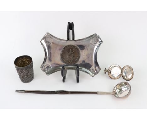 An Edwardian silver concave sided rectangular dish, Birmingham 1902, makers mark H.A., inset with four Maundy coins 1840, 184