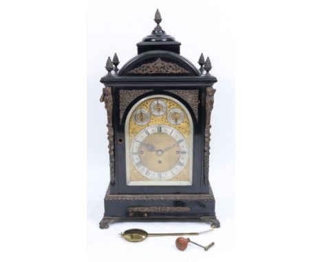 A late Victorian ebonised gilt metal mounted bracket clock and bracket, in mid 18th century style, un-named, the arched top w