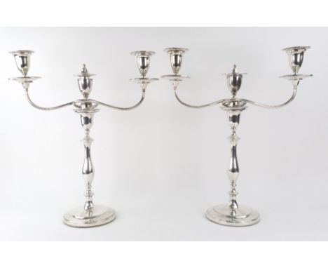 A pair of George III silver candlesticks, John Green & Co, Sheffield 1795, with vase shape scones and detachable nozzles, the