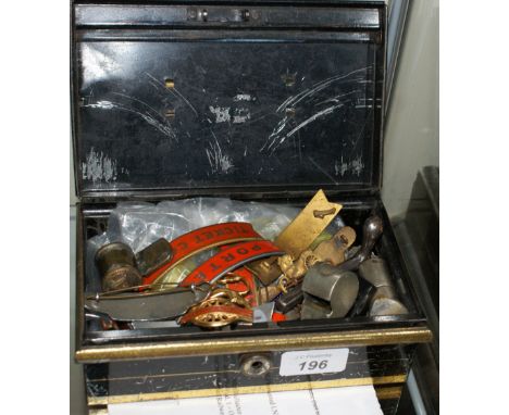 Vintage metal cash box containing railwayana including 38 buttons, 16 badges, 5 whistles and one wheel tester