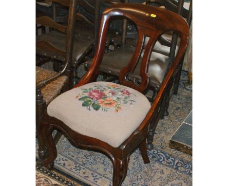 Victorian mahogany spoon back chair on scroll feet with wool tapestry floral seat pad