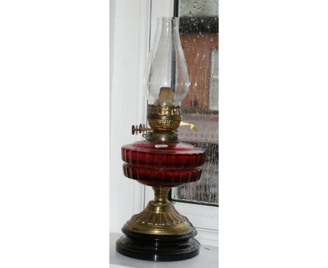 Victorian brass and cranberry glass oil lamp