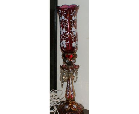 Cranberry glass lustre-style electric lamp and shade hand-painted with white enamel flowers