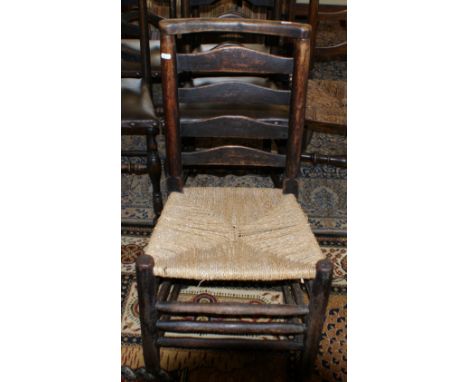 Antique country ladder-back chair with rush seat