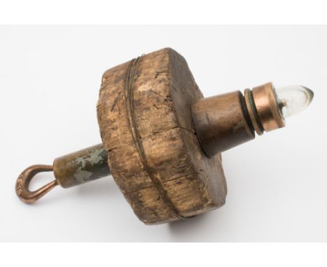 A  cork and brass buoy light:, of typical form, 34cm long.
