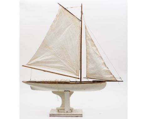 A scale model pond yacht 'Chui':, fully rigged above simulated plank deck and white painted hull with lead weighted keel, 94c