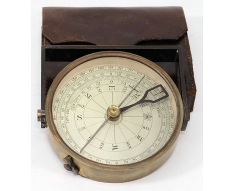A four inch brass sighting compass by A G Thornton, Manchester:, blued steel folding sight and calibrated dial, together with
