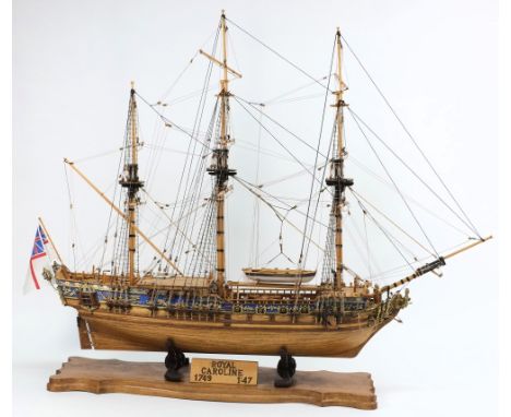 A 1/47 scale model of HMY The Royal Caroline:, standing and running rigged with detailed decks and brass cannon, blue gunwale