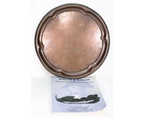 A circular copper 'Nelson's Victory Centenary Memento' tray:, with central ship portrait within a rope birder on a fouled anc