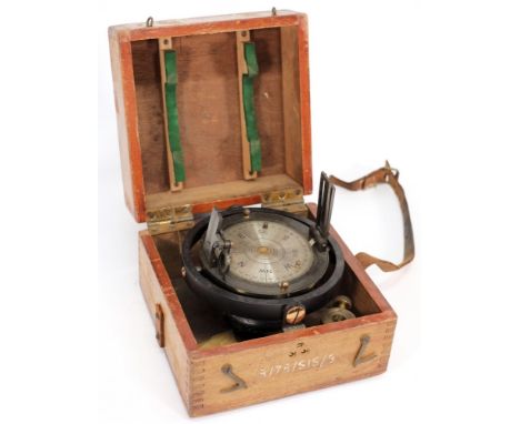 A lacquered brass sighting compass:, the 4 inch compass with folding sights and shades in a gimbaled mount in a fitted case s