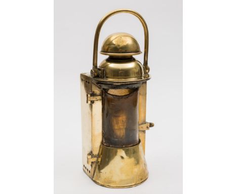 An early 20th century brass ship's bulkhead lamp by Bulpitt & Sons, Birmingham:, the brass handle over single bowfront door e