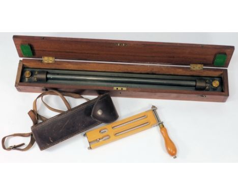A lacquered brass rolling rule by Kelvin & James White, Glasgow, together with a humidity hydrometer by G H Zeal, London:, th
