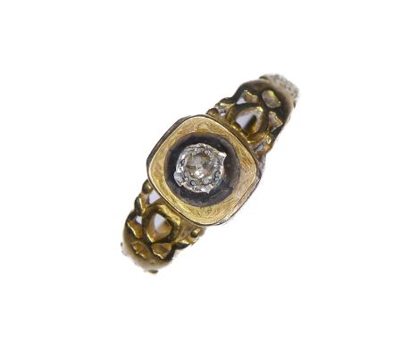 A cushion-shaped old brilliant-cut diamond ring collet set above the pierced and engraved tapering shank stamped '18CT' (ring