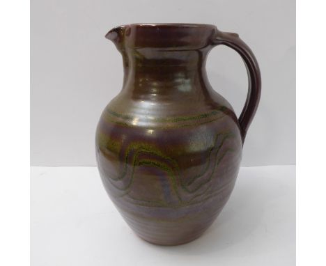Ray Finch (Winchcombe Pottery, Gloucestershire),&nbsp;bulbous jug; combed decoration through iron slip, celadon glaze (30cm h