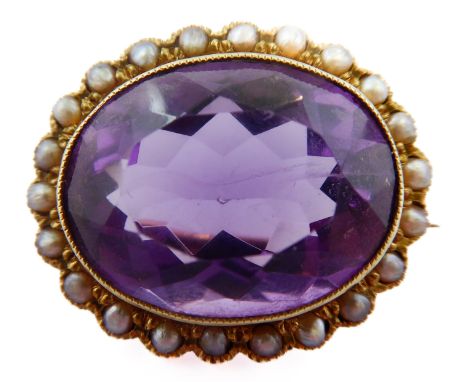 A late 19th century/early 20th century amethyst, half pearl and 15-carat yellow gold brooch, the oval amethyst collet set abo