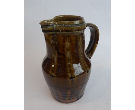Mike Dodd (Winchcombe Pottery): a mottled brown glazed jug, impressed to base (21.5cm high)&nbsp;&nbsp;