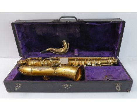 A cased saxophone: the sound horn engraved 'Buescher Elkhart Ind.', the instrument individually numbered to the rear 123945 (