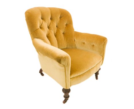 A 19th century light green button-back upholstered low chair on turned tapering front legs with castors (73cm widest x 84cm h