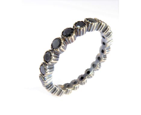 A black diamond full hoop eternity ring: the brilliant-cut diamonds collet-set to the semi-closed back setting, ring size M, 