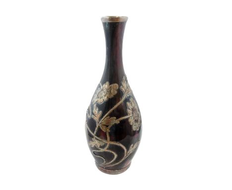 A late 19th/early 20th century silver overlay elongated baluster-shaped ceramic vase with Ruskin-style glazes, the florid ove