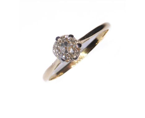 A diamond single stone ring: the old brilliant-cut diamond estimated to spread 0.45-0.50 carat coronet-set above the plain ta