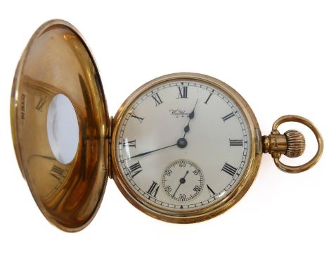 A 9-carat yellow gold half hunter pocket watch by Watham: keyless wind, the white enamel dial with Roman numerals and signed 