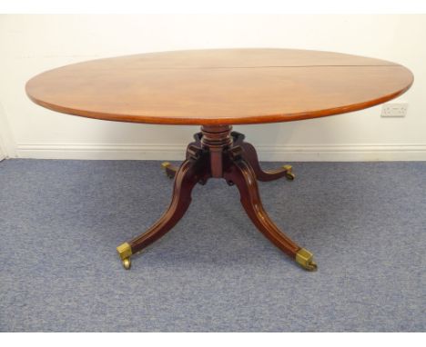 An early 19th century Regency period tilt-top oval mahogany loo table: the block stamped 'Wilkinson Ltd - Gatehill - 4520', t