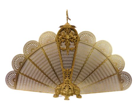 A fine and heavy elaborate gilt-metal fire-screen of peacock plume form: the handle above a central armorial crest flanked by