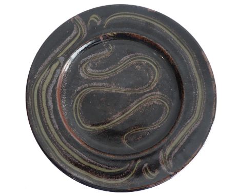 Ray Finch (Winchcombe Pottery, Gloucestershire), charger; combed meander and basket weave decoration through rust slip, celad