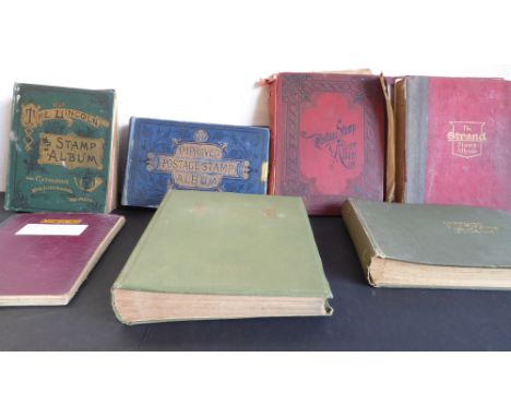 Eight vintage albums, some remaindered world stamps