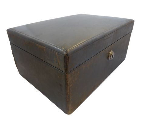 An early 20th century green leather upholstered jewellery box containing a variety of mostly costume jewellery and to include