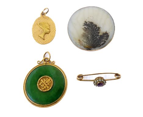 Four items: a circular jadeite disc pendant with rope-twist border and central Chinese symbol insert: an oval engine-turned p