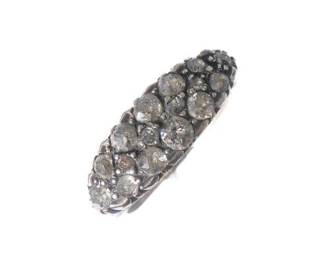 A late Victorian diamond-set ring: the old brilliant-cut diamond-set surround with a central line of old-cut diamonds, the pl