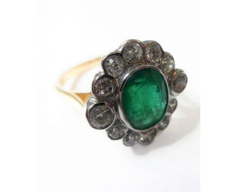 An 18-carat gold, emerald and diamond cluster ring, ring size N½ Condition Report: Overall condition very good with little si