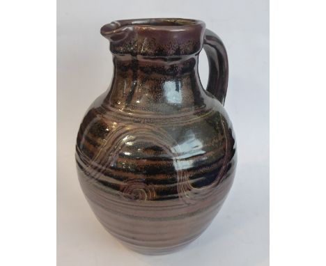 Ray Finch (Winchcombe Pottery, Gloucestershire),&nbsp;bellied jug; iron slip, combed decoration, celadon glaze (33cm high)&nb