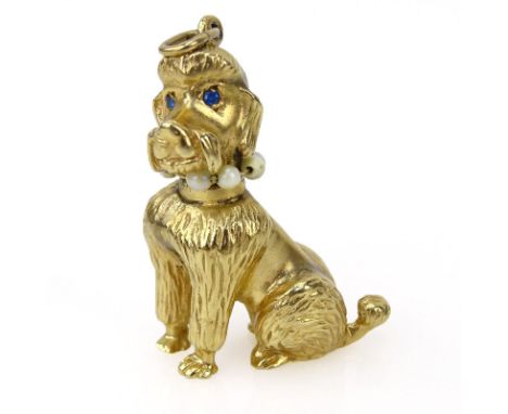 Vintage 14 Karat Yellow Gold Poodle Charm with Sapphire Eyes and Pearl Collar. Stamped 14K. Good condition. Measures 1-3/8" H