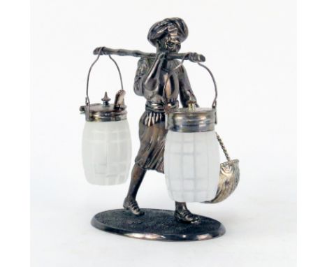 Vintage Silverplate and Glass Figural Nubian Condiment Server. Unsigned. Good vintage condition. Measures 6-1/4" H, 5-1/8" L.