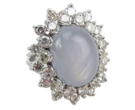 Approx. 22.0 Carat Oval Cabochon Star Sapphire, 4.25 Carat Round Brilliant Cut Diamond and Platinum Ring. Diamonds F-H color,