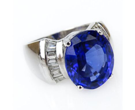 Approx. 7.51 Carat Oval Cut Tanzanite, Diamond and 14 Karat White Gold Ring. Tanzanite with vivid saturation of color. Stampe