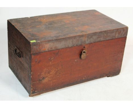 An antique 19th century Victorian mahogany chest having a hinged lid opening to reveal a spacious interior. The chest has met