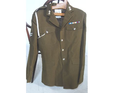 A 20th century British Army ' No.2 Dress Army ' uniform jacket - Royal Artillery. The uniform with medal ribbons, original bu