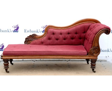 19th century mahogany button back chaise lounge with carved show frame, and turned feet on castors, H93 x W195 x D59cm       