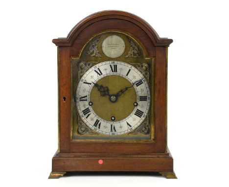 George III style mahogany and brass mounted bracket clock, arched pediment above arched brass dial with silvered chapter ring