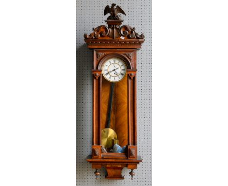 Mahogany cased Vienna Regulator, with carved eagle and scrolling foliate surmount above enamel dial with Roman numerals and s