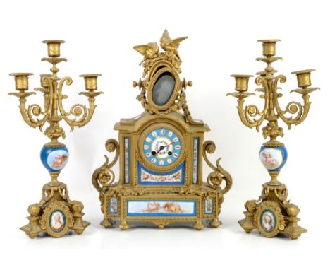 French gilt metal clock garniture, the clock with two birds and floral swags to finial, brass drum movement striking a bell, 