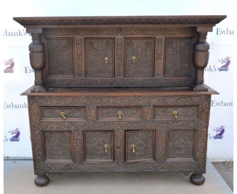 18th century and later floral carved oak buffet, with carved cornice and twin baluster turned pillars above two doors, three 